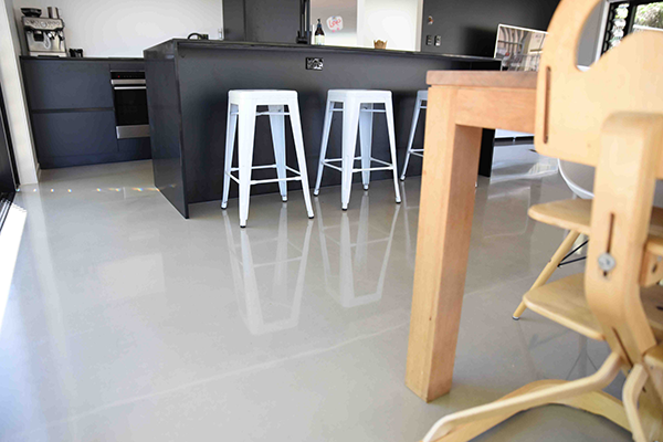 polished concrete floor in kitchen and dining area ofAuckland house